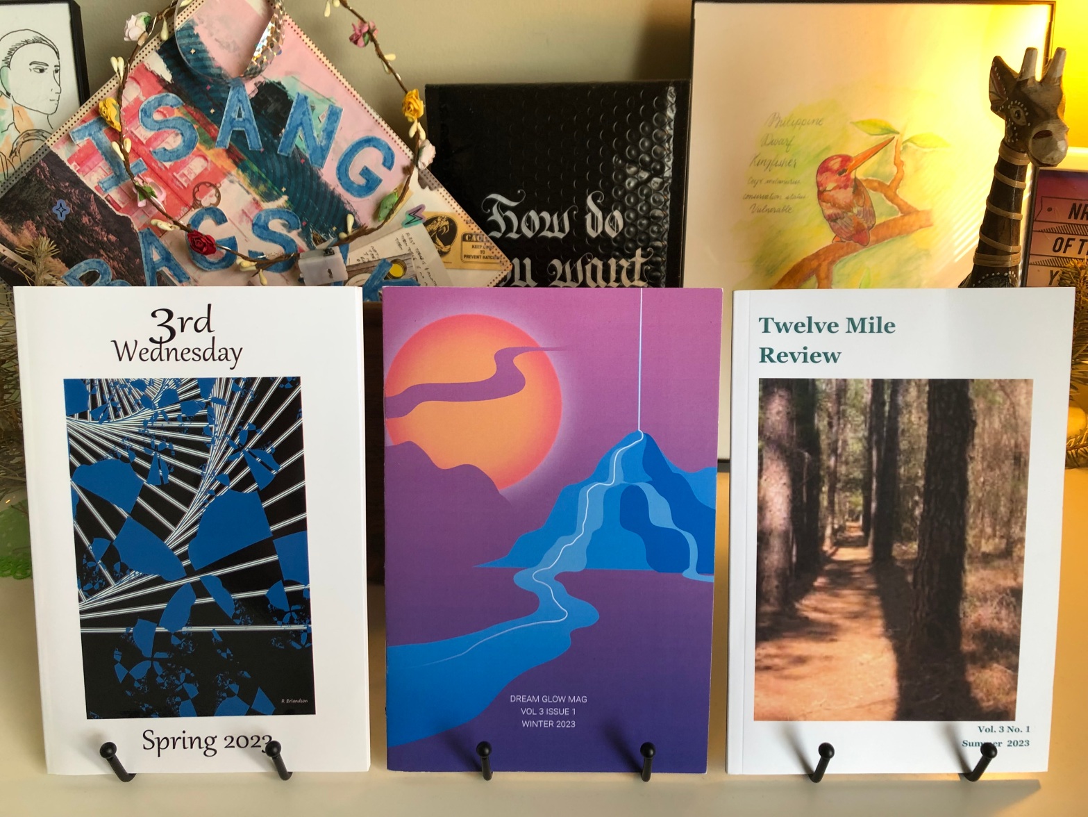 Photograph of three print literary magazines: 3rd Wednesday, Dream Glow, and Twelve Mile Review